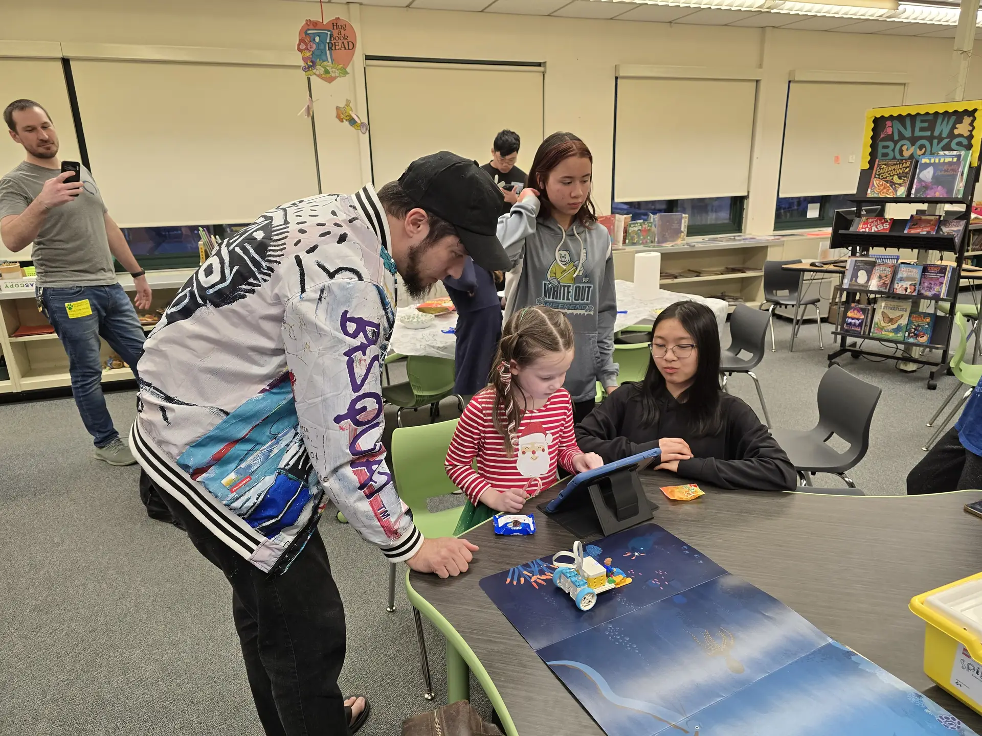FLL student showing how to program their robot