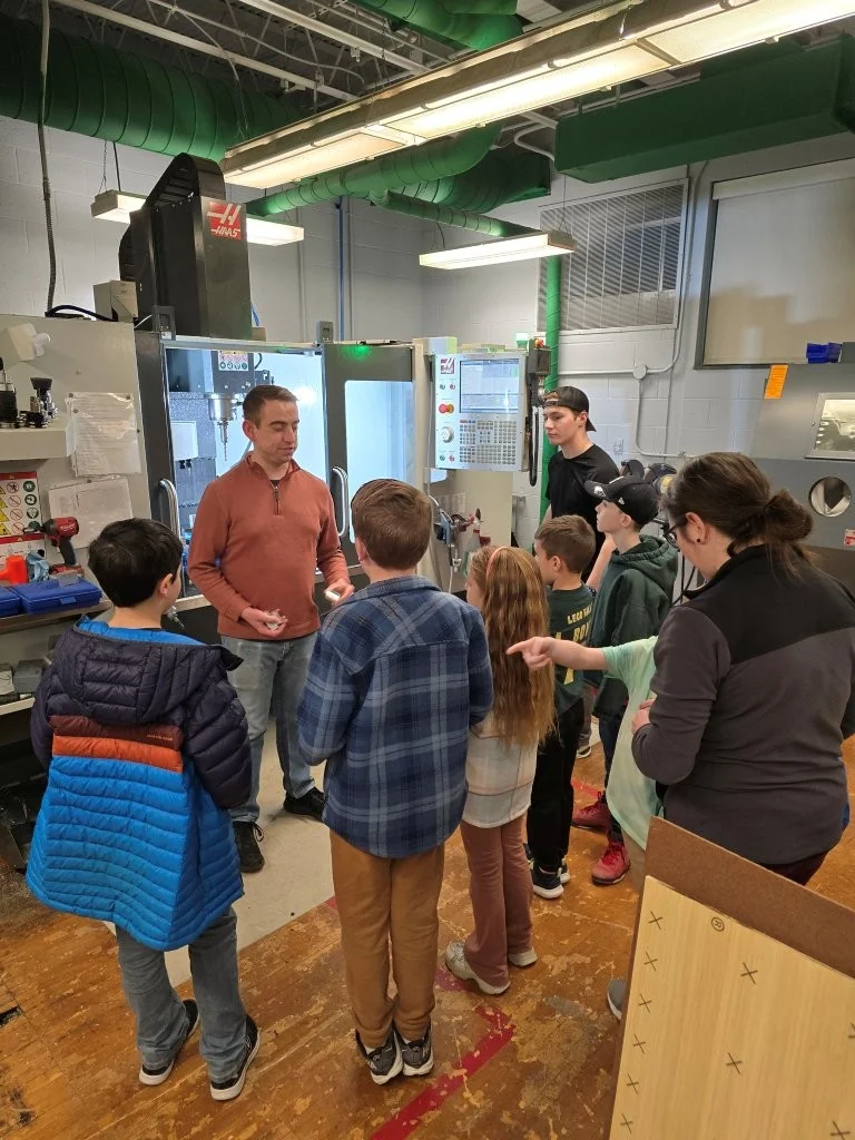 Showing how the CNC lathe makes parts for Rattlesnake